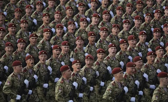 Russian servicemen march towards the Red Square prior to the Victory Day military parade general rehearsal in Moscow, Russia, Wednesday, May 7, 2025. (AP Photo/Pavel Bednyakov)