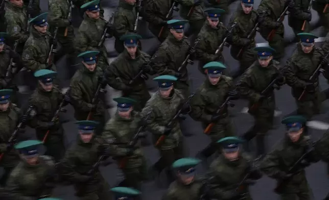 Russian servicemen march towards the Red Square prior to the Victory Day military parade rehearsal in Moscow, Russia, Saturday, May 3, 2025. (AP Photo/Pavel Bednyakov)