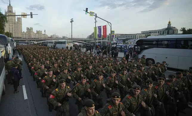 Russian servicemen march along Moskvoretskaya embankment towards the Red Square prior to the Victory Day military parade rehearsal in Moscow, Russia, Saturday, May 3, 2025. (AP Photo/Pavel Bednyakov)