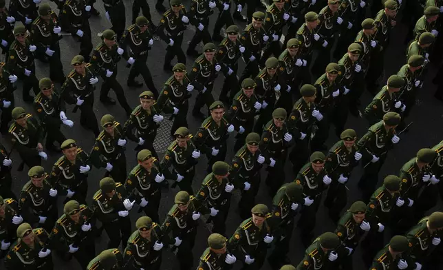 Russian servicemen march towards the Red Square prior to the Victory Day military parade general rehearsal in Moscow, Russia, Wednesday, May 7, 2025. (AP Photo/Pavel Bednyakov)