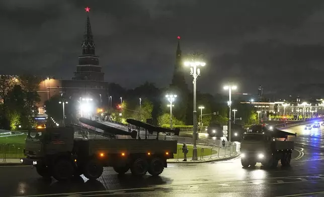 Russian military trucks carrying Geran-2 unmanned aerial vehicles roll along Borovitskaya Square next to the Kremlin after a rehearsal for the Victory Day military parade in Moscow, Russia, on Tuesday, April 29, 2025. (AP Photo/Pavel Bednyakov)