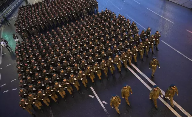 Troops march toward Red Square to attend a rehearsal for the Victory Day military parade in Moscow, Russia, on Tuesday, April 29, 2025. (AP Photo/Alexander Zemlianichenko)