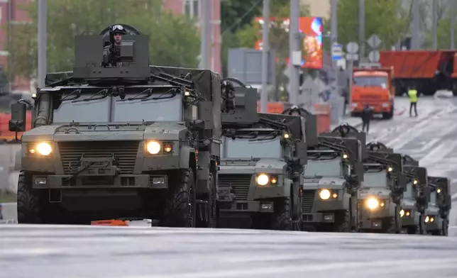Russian armoured vehicles roll along the street toward Red Square to attend a rehearsal for the Victory Day military parade in Moscow, Russia, on Tuesday, April 29, 2025. (AP Photo/Alexander Zemlianichenko)