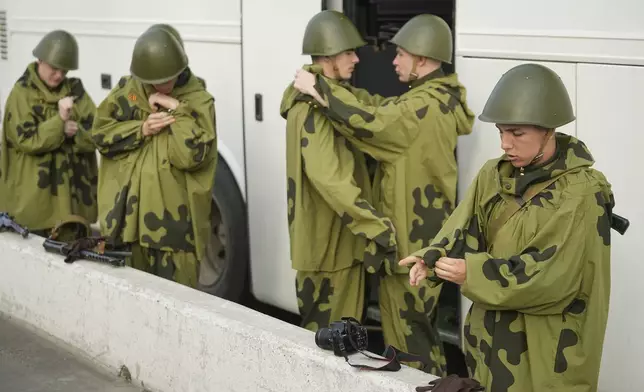 Russian servicemen prepare prior to the Victory Day military parade general rehearsal in Moscow, Russia, Wednesday, May 7, 2025. (AP Photo/Pavel Bednyakov)
