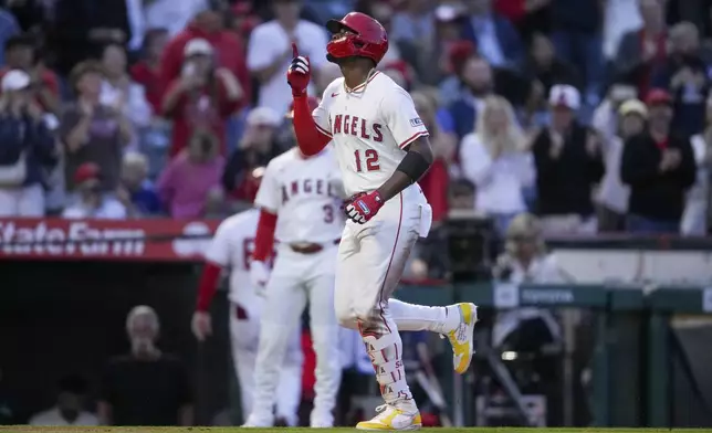 Los Angeles Angels' Jorge Soler (12) reacts after hitting a home run during the third inning of a baseball game against the Detroit Tigers, Thursday, May 1, 2025, in Anaheim, Calif. (AP Photo/Eric Thayer)