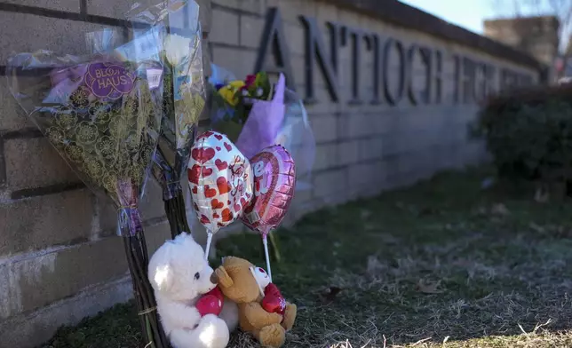 FILE - Flowers and stuffed animals are seen at a memorial for victims of a shooting at Antioch High School, Thursday, Jan. 23, 2025, in Nashville, Tenn. (AP Photo/George Walker IV, File)