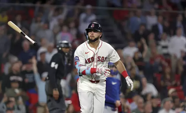 Boston Red Sox's Wilyer Abreu tosses his bat away after hitting a home run during the fourth inning of a baseball game against the Texas Rangers on Wednesday, May 7, 2025, in Boston. (AP Photo/Jim Davis)
