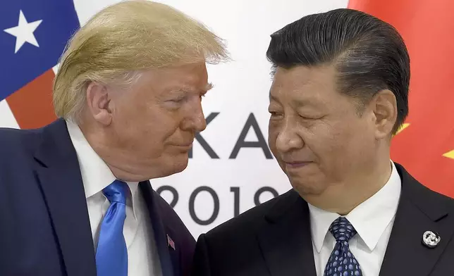 FILE - U.S. President Donald Trump, left, meets with Chinese President Xi Jinping during a meeting on the sidelines of the G-20 summit in Osaka, Japan, June 29, 2019. (AP Photo/Susan Walsh, File)