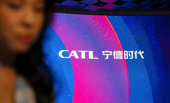 Signage of Contemporary Amperex Technology Co. (CATL) is displayed on the digital screen at the listing ceremony in Hong Kong, Tuesday, May. 20, 2025. (AP Photo/Chan Long Hei)