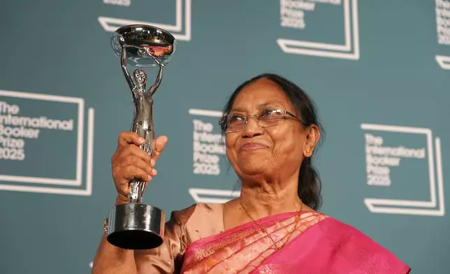 Banu Mushtaq, author of 'Heart Lamp' holds the trophy after winning the International Booker Prize, in London, Tuesday, May 20, 2025.(AP Photo/Alberto Pezzali)