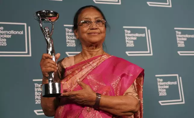 Banu Mushtaq, author of 'Heart Lamp' holds the trophy after winning the International Booker Prize, in London, Tuesday, May 20, 2025.(AP Photo/Alberto Pezzali)