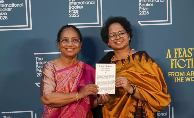 Banu Mushtaq, author of 'Heart Lamp' left, and Deepa Bhasthi pose for photographers upon arrival for the International Booker Prize, in London, Tuesday, May 20, 2025.(AP Photo/Alberto Pezzali)