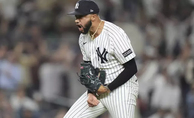 New York Yankees pitcher Devin Williams celebrates after striking out San Diego Padres' Xander Bogaerts during the 10th inning of a baseball game Wednesday, May 7, 2025, in New York. (AP Photo/Frank Franklin II)