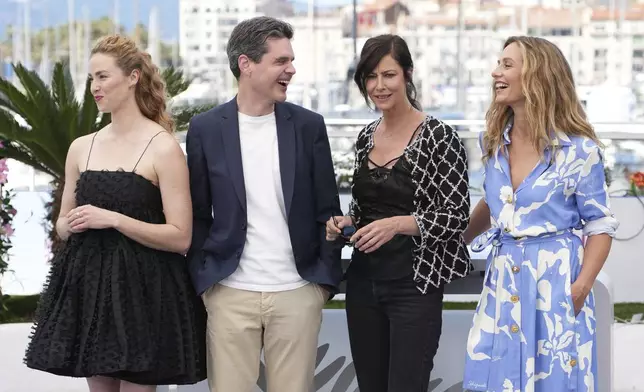 Freya Mavor, from left, director Yann Gozlan, Anna Mouglalis, and Cecile de France pose for photographers at the photo call for the film 'Dalloway' at the 78th international film festival, Cannes, southern France, Thursday, May 15, 2025. (AP Photo/Natacha Pisarenko)