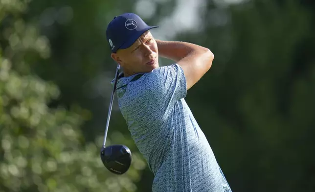 Matti Schmid wathches his tee shot on the 9th hole during the first round of the Charles Schwab Challenge golf tournament at Colonial Country Club in Fort Worth, Texas, Thursday, May 22, 2025. (AP Photo/Julio Cortez)