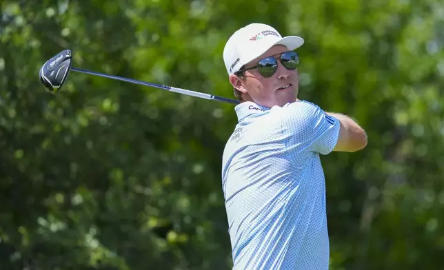 Ben Griffin hits off the ninth tee on the during the first round of the Charles Schwab Challenge golf tournament at Colonial Country Club in Fort Worth, Texas, Thursday, May 22, 2025. (AP Photo/LM Otero)