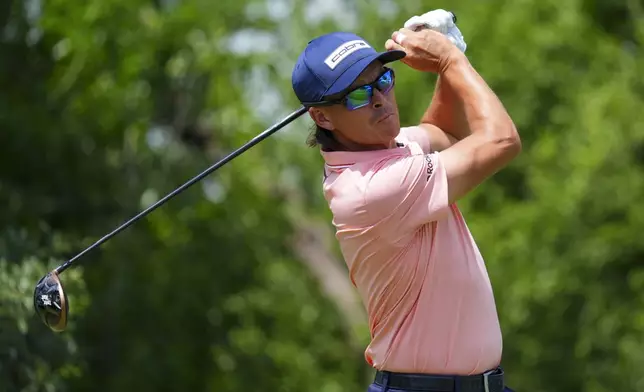 Rickie Fowler hits off the ninth hole during the first round of the Charles Schwab Challenge golf tournament at Colonial Country Club in Fort Worth, Texas, Thursday, May 22, 2025. (AP Photo/LM Otero)