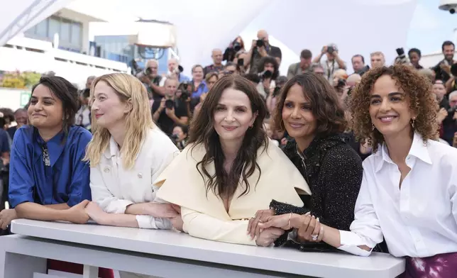 Jury president Juliette Binoche, centre, and jury members Payal Kapadia, from left, Alba Rohrwacher, Halle Berry and Leila Slimani pose for photographers at the jury photo call at the 78th international film festival, Cannes, southern France, Tuesday, May 13, 2025. (AP Photo/Natacha Pisarenko)