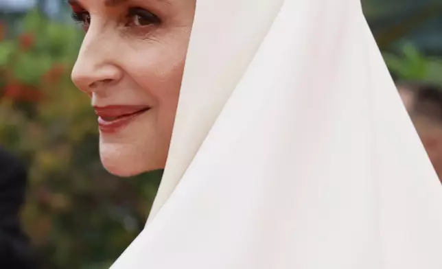 Jury president Juliette Binoche poses for photographers during the opening ceremony red carpet of the 78th international film festival, Cannes, southern France, Tuesday, May 13, 2025. (Photo by Joel C Ryan/Invision/AP)