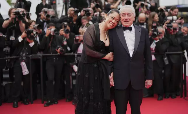 Tiffany Chen, left, and Robert De Niro pose for photographers during the opening ceremony red carpet of the 78th international film festival, Cannes, southern France, Tuesday, May 13, 2025. (Photo by Scott A Garfitt/Invision/AP)