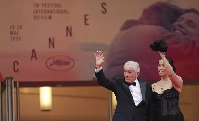 Robert De Niro, left, and Tiffany Chen pose for photographers during the opening ceremony red carpet of the 78th international film festival, Cannes, southern France, Tuesday, May 13, 2025. (Photo by Scott A Garfitt/Invision/AP)