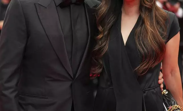 Sean Baker, left, and Samantha Quan pose for photographers during the opening ceremony red carpet of the 78th international film festival, Cannes, southern France, Tuesday, May 13, 2025. (Photo by Scott A Garfitt/Invision/AP)
