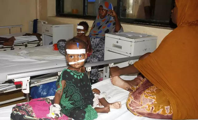 Malnourished children receive treatment at Banadir Hospital in Mogadishu, Somalia, Wednesday, May 14, 2025. (AP Photo/Farah Abdi Warsameh)