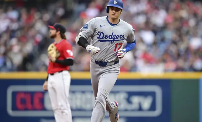 Los Angeles Dodgers' Shohei Ohtani runs the bases after hitting a two run home run off Cleveland Guardians starting pitcher Tanner Bibee during the fourth inning of a baseball game, Tuesday, May 27, 2025, in Cleveland. (AP Photo/David Dermer)