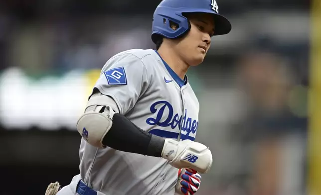 Los Angeles Dodgers' Shohei Ohtani runs the bases after hitting a two run home run off Cleveland Guardians starting pitcher Tanner Bibee during the fourth inning of a baseball game, Tuesday, May 27, 2025, in Cleveland. (AP Photo/David Dermer)