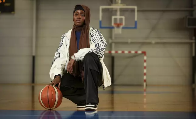 Former player Salimata Sylla poses before a women's basketball tournament where players can wear a headscarf, in Aubervilliers near Paris, Sunday, April 27, 2025. (AP Photo/Thomas Padilla)