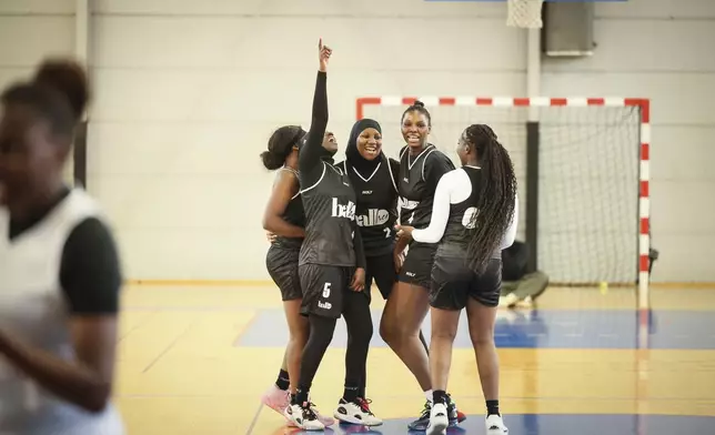 Players react during a basketball game in Aubervilliers near Paris, Sunday, April 27, 2025. (AP Photo/Thomas Padilla)