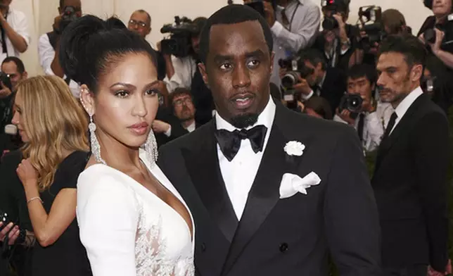 FILE - Cassie Ventura, left, and Sean "Diddy" Combs appear at The Metropolitan Museum of Art's Costume Institute benefit gala celebrating "China: Through the Looking Glass" in New York on May 4, 2015. (Photo by Charles Sykes/Invision/AP, File)