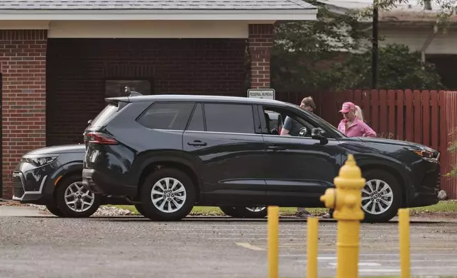 Savannah Chrisley, daughter of reality television star Todd Chrisley, waits for the release of her father at the Federal Prison Camp, Wednesday, May 28, 2025, in Pensacola, Fla. (AP Photo/Dan Anderson)