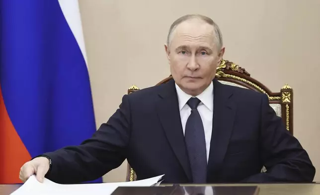 Russian President Vladimir Putin attends a meeting on forthcoming Russia-Ukraine talks in Istanbul, in Moscow, Russia, Wednesday, May 14, 2025. (Alexander Kazakov, Sputnik, Kremlin Pool Photo via AP)