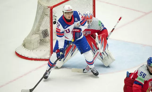 Tage Thompson of the US, front, and Czech Republic goalkeeper Karel Vejmelka in action during a Group B match between Czech Republic' and the US at the hockey world championships in Herning, Denmark, Tuesday, May 20, 2025. (Bo Amstrup/Ritzau Scanpix via AP)