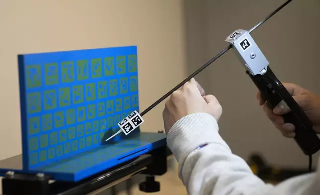 Alejandra Gonzalez practices virtual welding during an Ironworkers Local 63 pre-apprenticeship class Wednesday, March 26, 2025, in Broadview, Ill. (AP Photo/Erin Hooley)