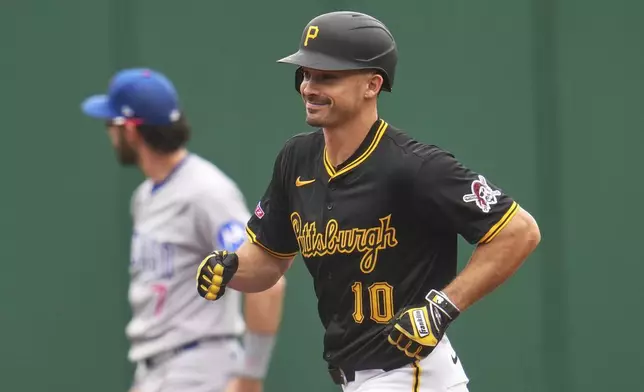 Pittsburgh Pirates' Bryan Reynolds (10) rounds the bases after hitting a solo home run off Chicago Cubs pitcher Colin Rea during the first inning of a baseball game in Pittsburgh, Thursday, May 1, 2025. (AP Photo/Gene J. Puskar)