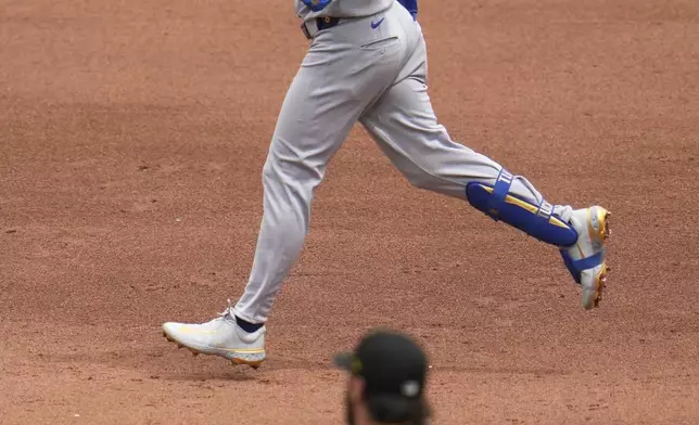 Chicago Cubs' Kyle Tucker (30) rounds the bases after hitting a solo home run off Pittsburgh Pirates pitcher Paul Skenes (30) during the fifth inning of a baseball game in Pittsburgh, Thursday, May 1, 2025. (AP Photo/Gene J. Puskar)