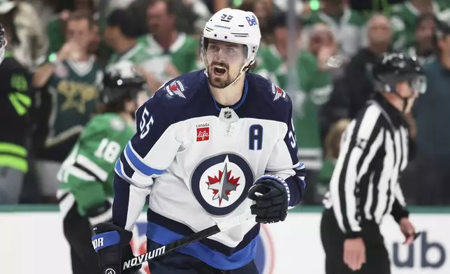 Winnipeg Jets' Mark Scheifele shouts in the direction of an official after being issued a penalty for tripping in the third period of Game 6 of a second-round NHL hockey playoff series against the Dallas Stars in Dallas, Saturday, May 17, 2025. (AP Photo/Gareth Patterson)