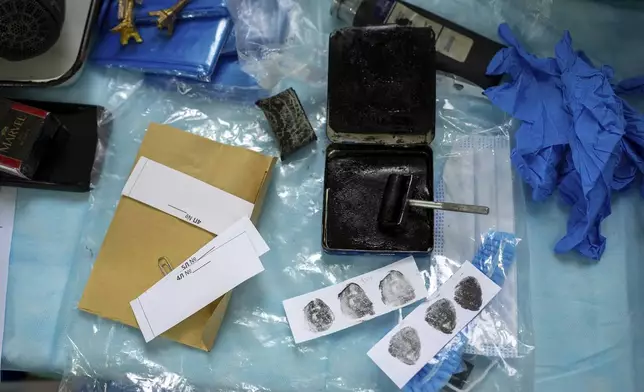 Fingerprints taken from the body of a Ukrainian prisoner of war returned by Russia, at a morgue in Kyiv, Ukraine, June 24, 2024. (AP Photo/Alex Babenko)
