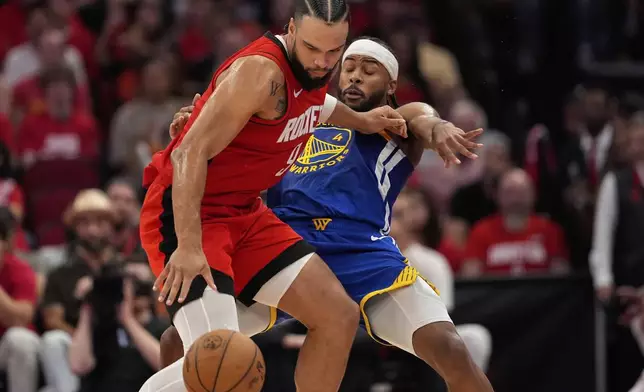Houston Rockets forward Dillon Brooks (9) backs down Golden State Warriors guard Moses Moody (4) during the second half of Game 5 of an NBA basketball first-round playoff series, Wednesday, April 30, 2025, in Houston. (AP Photo/David J. Phillip)
