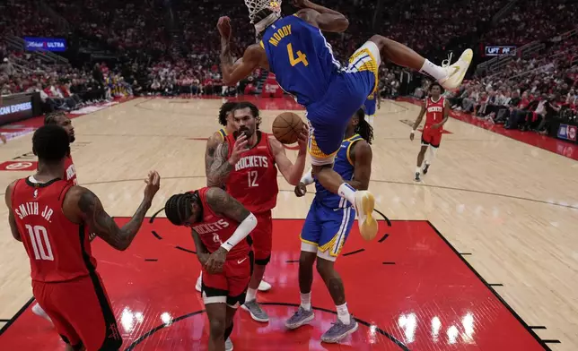 Golden State Warriors guard Moses Moody (4) dunks against the Houston Rockets during the first half of Game 5 of an NBA basketball first-round playoff series, Wednesday, April 30, 2024, in Houston. (AP Photo/David J. Phillip)