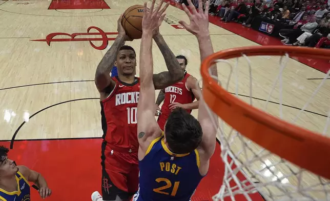 Houston Rockets forward Jabari Smith Jr. (10) shoots over Golden State Warriors center Quinten Post (21) during the second half of Game 5 of an NBA basketball first-round playoff series, Wednesday, April 30, 2025, in Houston. (AP Photo/David J. Phillip)