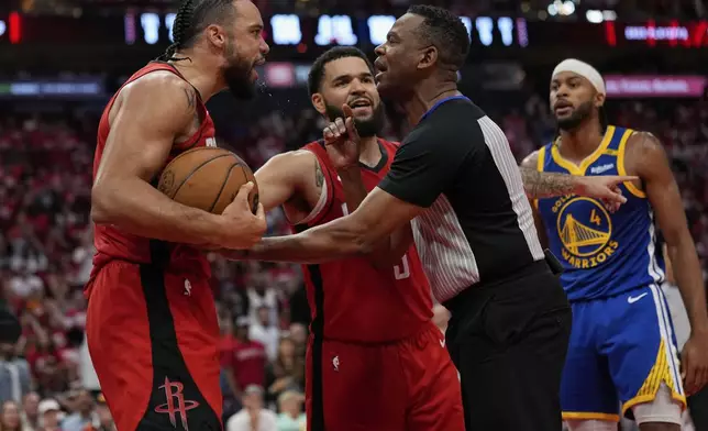 Houston Rockets center Alperen Sengun, left, argues with the referee during the second half of Game 5 of an NBA basketball first-round playoff series against the Golden State Warriors, Wednesday, April 30, 2025, in Houston. (AP Photo/David J. Phillip)