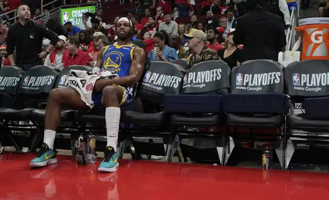 Golden State Warriors guard Buddy Hield (7) sits on the bench during the second half of Game 5 of an NBA basketball first-round playoff series against the Houston Rockets, Wednesday, April 30, 2025, in Houston. (AP Photo/David J. Phillip)