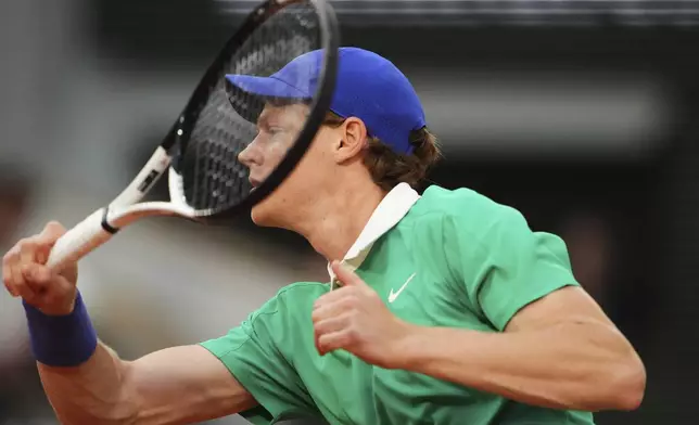 Italy's Jannik Sinner hits a forehand against France's Arthur Rinderknech during their first round match of the French Tennis Open, at the Roland-Garros stadium, in Paris, Monday, May 26, 2025. (AP Photo/Lindsey Wasson)
