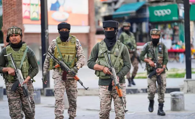 Indian soldiers guard at a market in Srinagar, Indian controlled Kashmir, Tuesday, May 6, 2025. (AP Photo/Mukhtar Khan)