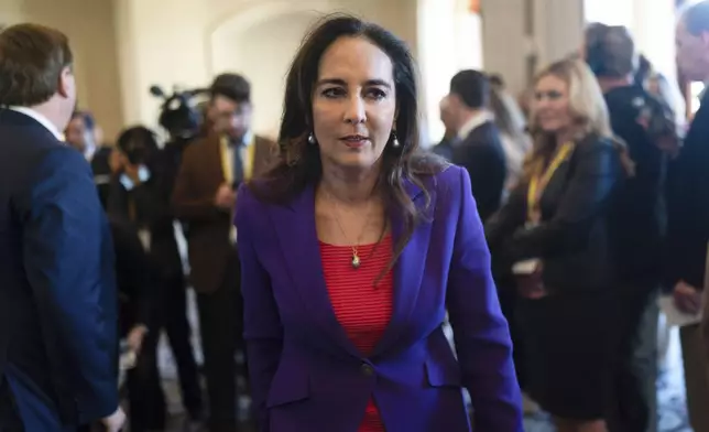 FILE - Harmeet Dhillon walks through a hallway after talking to reporters at the Republican National Committee winter meeting in Dana Point, Calif., Jan. 27, 2023. (AP Photo/Jae C. Hong, File)