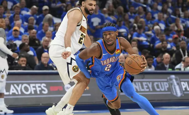 Oklahoma City Thunder guard Shai Gilgeous-Alexander (2) works to the basket against Denver Nuggets guard Jamal Murray, left, in the second half of Game 7 in the Western Conference semifinals of the NBA basketball playoffs, Sunday, May 18, 2025, in Oklahoma City. (AP Photo/Kyle Phillips)