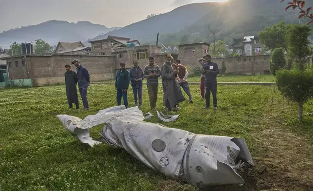 Debris of an aircraft lie in the compound of a mosque at Pampore in Pulwama district of Indian controlled Kashmir, Wednesday, May 7, 2025. (AP Photo/Dar Yasin)